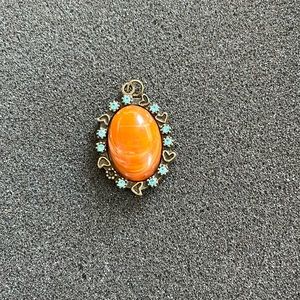 3/20.00 Amber-like pendant with turquoise stones.